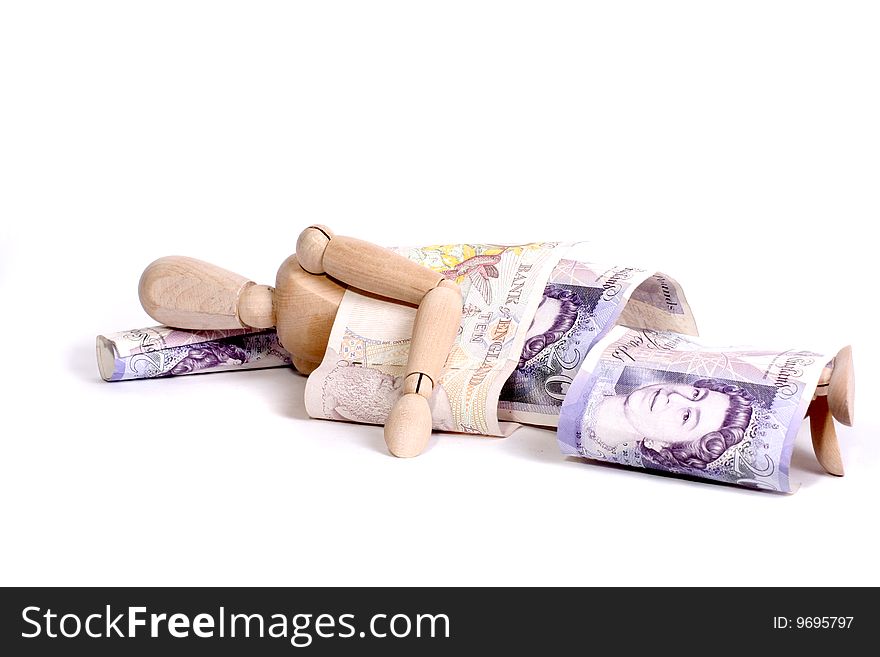 A mannequin sleeping under ten and twenty pound notes. A mannequin sleeping under ten and twenty pound notes.