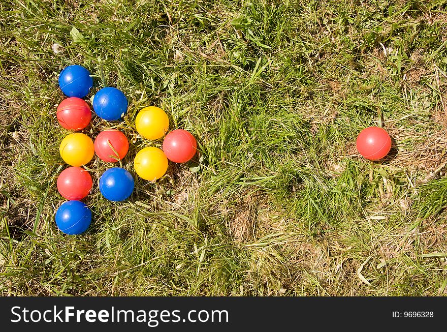 Multicolored balls in the garden. Multicolored balls in the garden