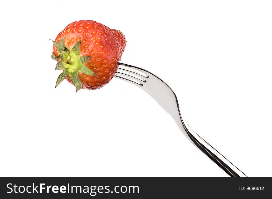 Strawberry close-up on a fork