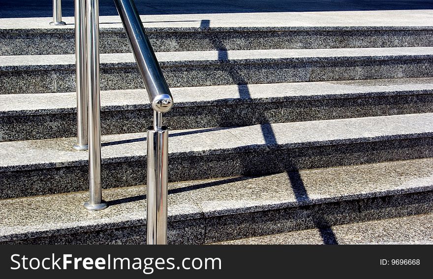 Stairs to modern building with rail