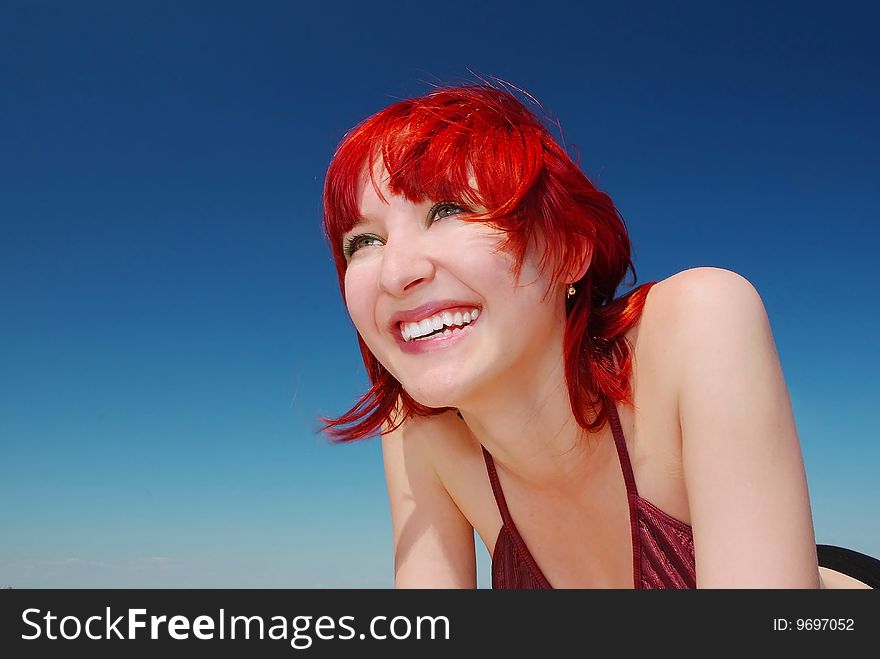 Red-haired girl at the beach on sunny day. Red-haired girl at the beach on sunny day