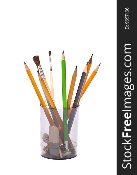 Office sets - pencils, brushes, rubber eraser in plastic glass