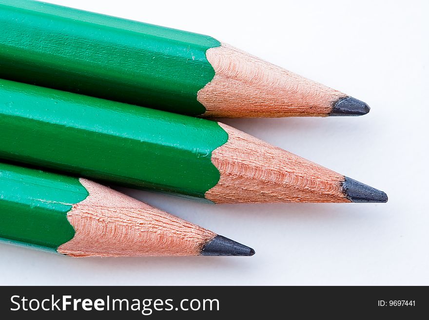 Three drawing pencils, arranged horizontally