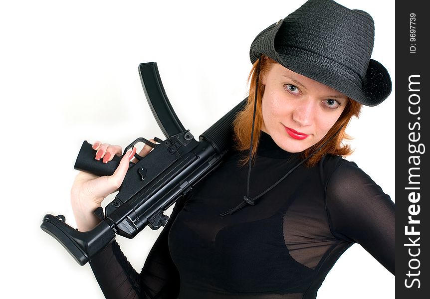 Sexy red young woman in a cowboy hat holding the gun