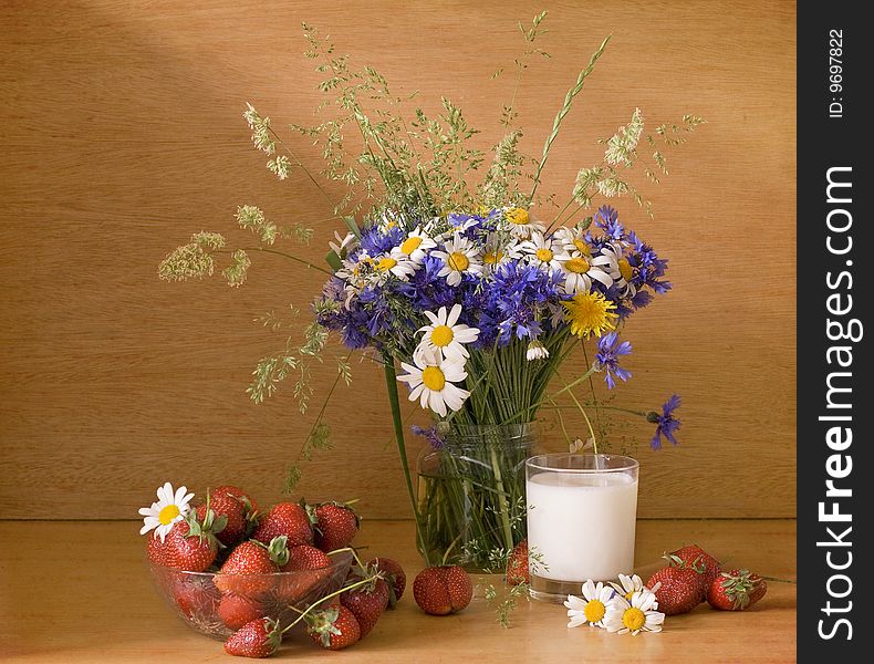 Strawberries and milk with flowers