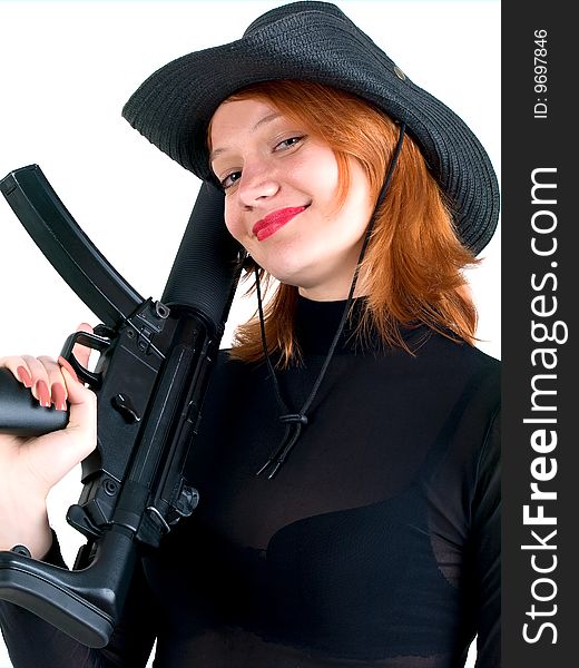 red young woman in a cowboy hat holding the gun