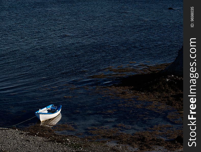 Blue and white boat in small bay, Northern Norway. Blue and white boat in small bay, Northern Norway