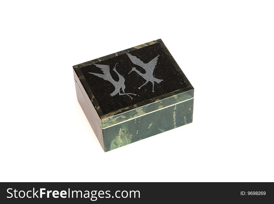 Jasper stone casket engraved with dancing cranes isolated. Jasper stone casket engraved with dancing cranes isolated