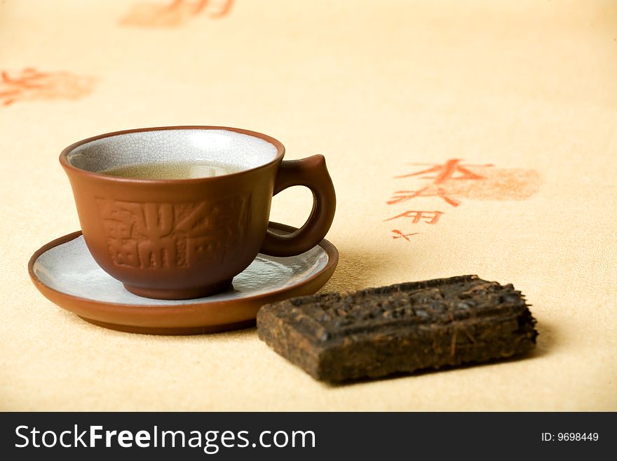 Porcelain tea cup with brick tea