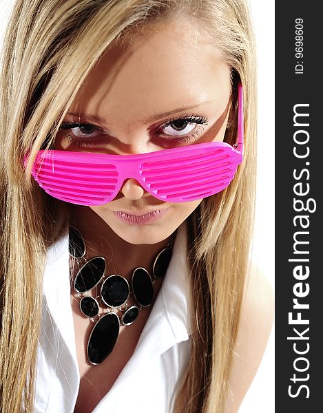 Young female model wearing a pair of plastic glasses fashion of the time. Young female model wearing a pair of plastic glasses fashion of the time.