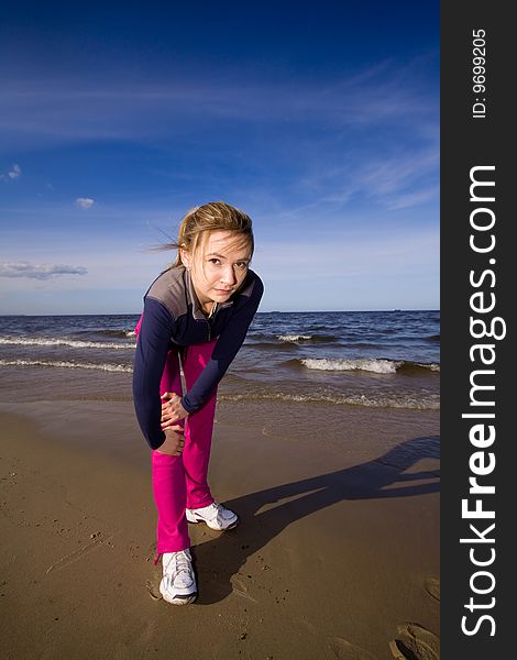 Active woman running on the beach. Active woman running on the beach