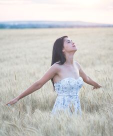 Beautiful Woman In Summer In Wheat Field At Sunset Royalty Free Stock Photo