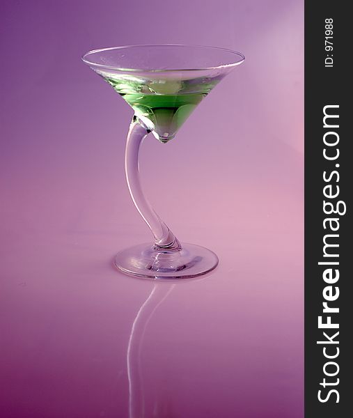 A refreshing AND unique martini style cocktail with a colorful and contrasty background. A refreshing AND unique martini style cocktail with a colorful and contrasty background.