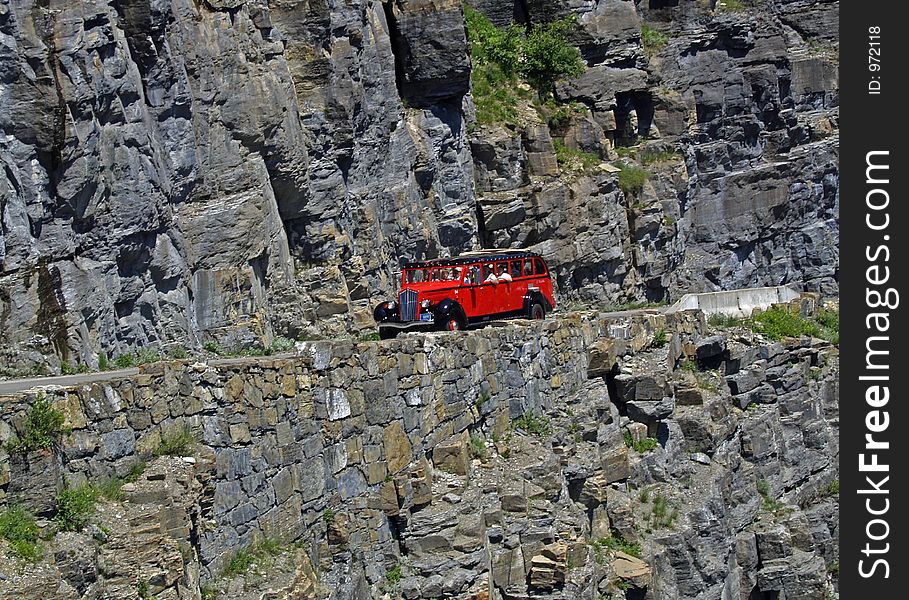 This image of the red bus (Jammer) was taken on Going-to-the-Sun highway in Glacier National Park. This image of the red bus (Jammer) was taken on Going-to-the-Sun highway in Glacier National Park.