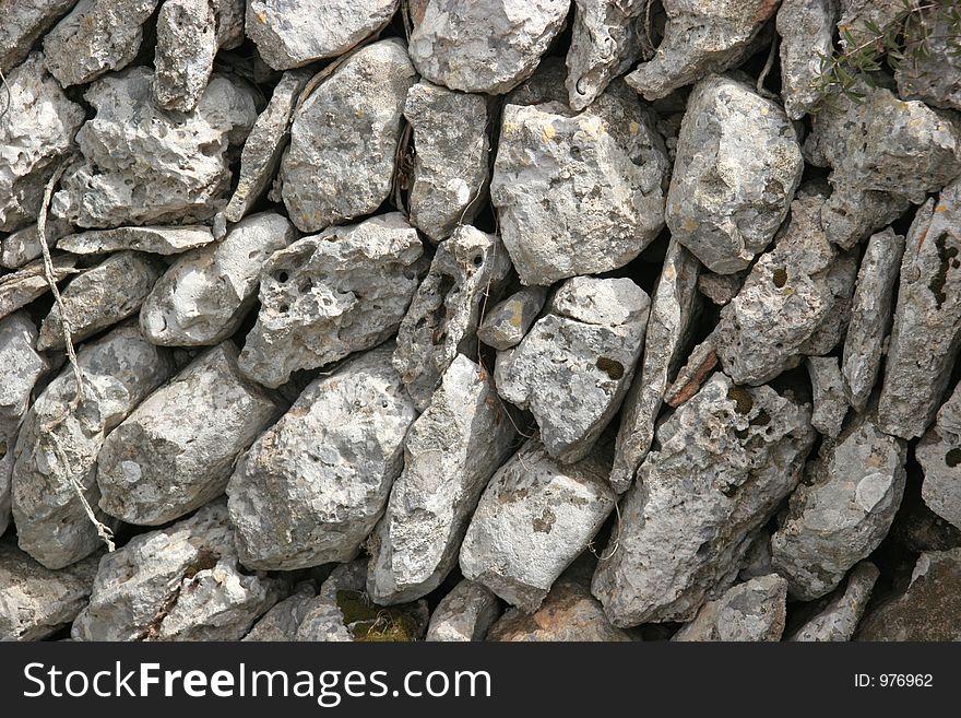 Wall made of grey stones, detail. Wall made of grey stones, detail