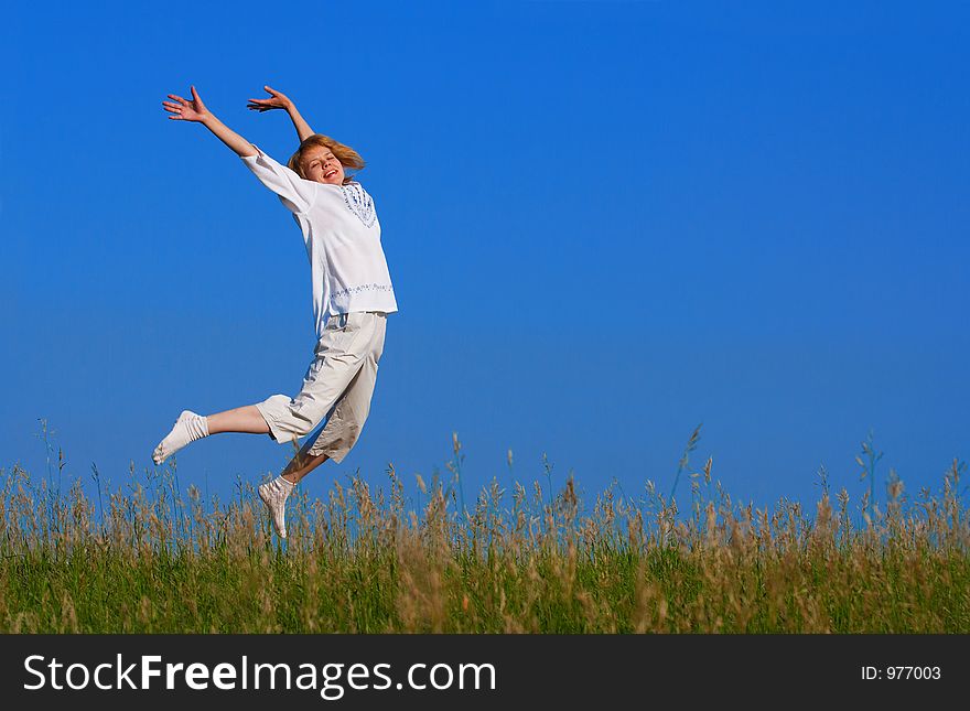 Beauty Girl Jumping In Field