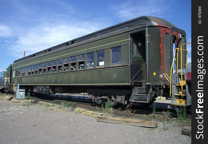 Photo of vintage passenger railroad car in Santa Fe New Mexico. This railroad car now transports tourists on a scenic railroad trip. Photo of vintage passenger railroad car in Santa Fe New Mexico. This railroad car now transports tourists on a scenic railroad trip.