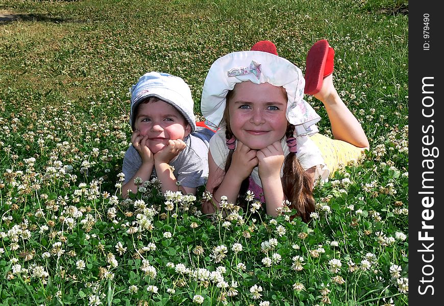 Boy and girl on a grass field. Boy and girl on a grass field