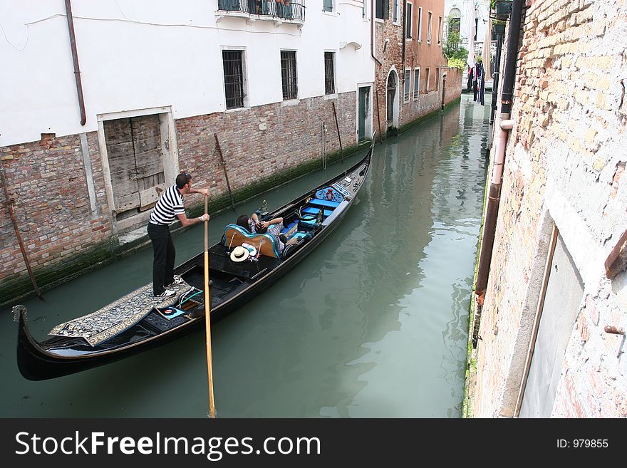 A gondela on the canal in Venice. A gondela on the canal in Venice.