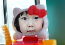 Asian Child In The Mirror Royalty Free Stock Photography