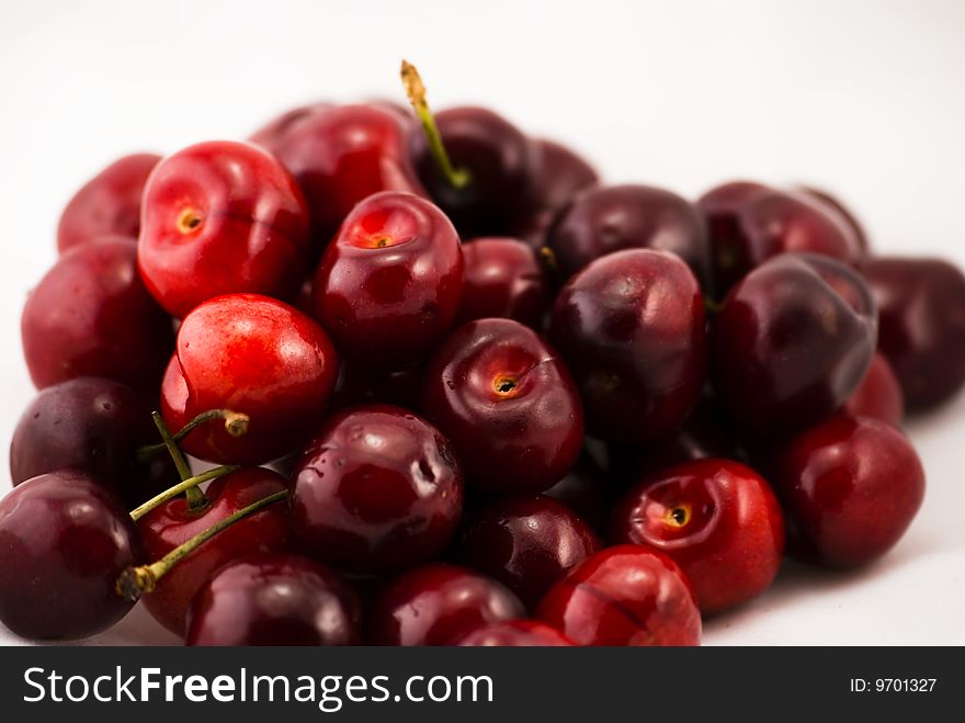 A pile of organic cherries isolated. A pile of organic cherries isolated