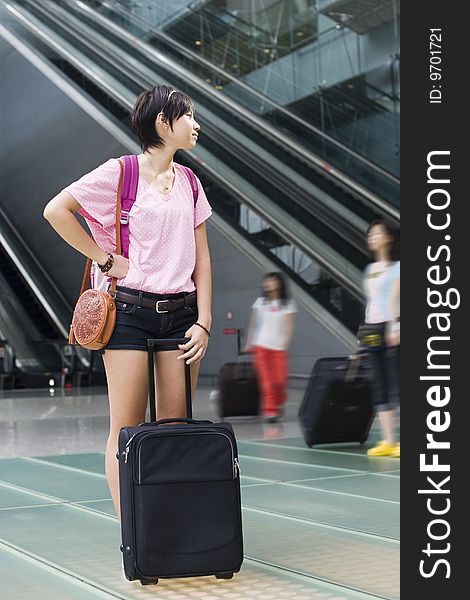 Asian girl at singapore s changi airport terminal