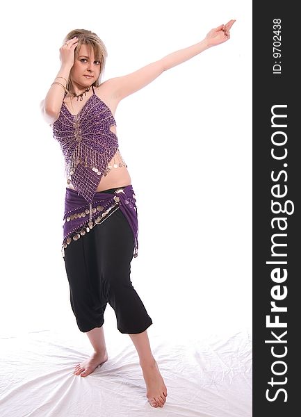 Indian dance. Young woman on white background.