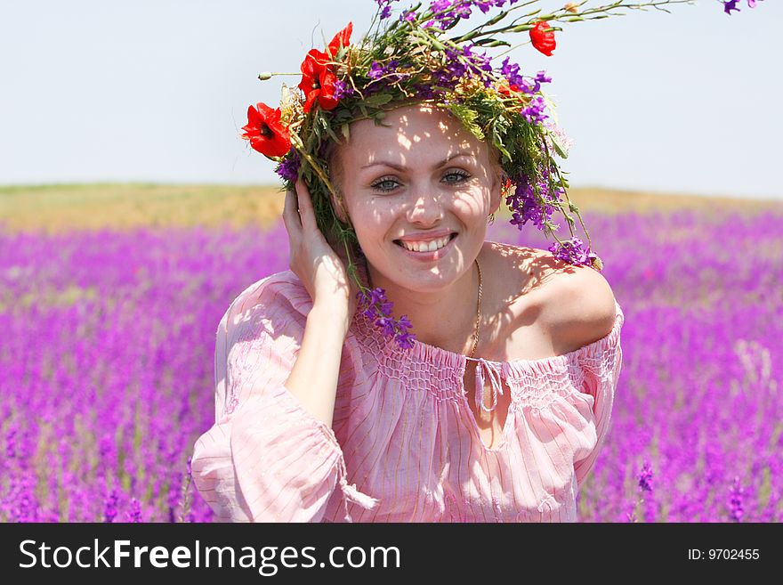 Happy Girl In Floral Wreath On Natural Background