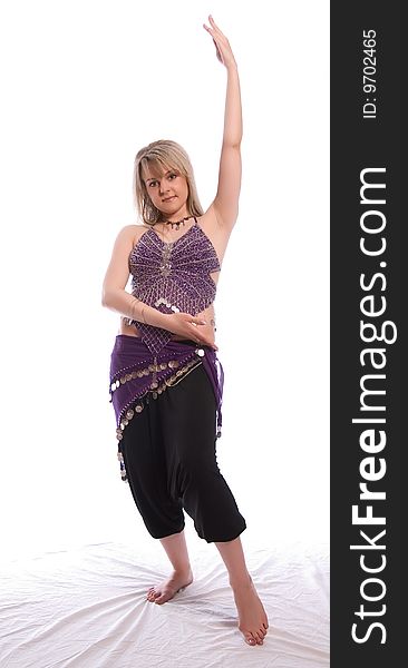 Indian dance. Young woman on white background.