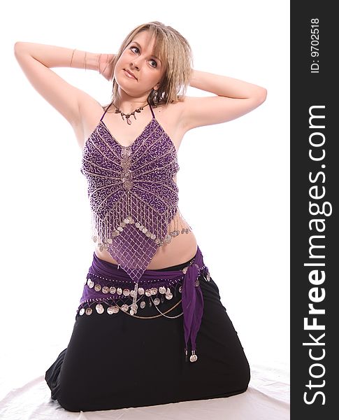 Indian dance. Young woman on white background.