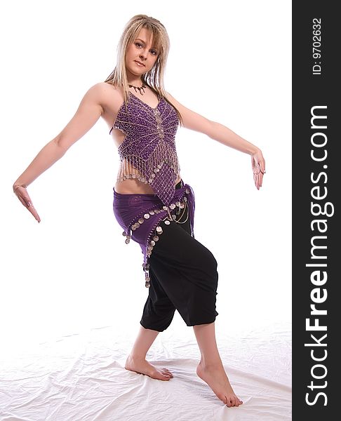 Indian dance. Young woman on white background.