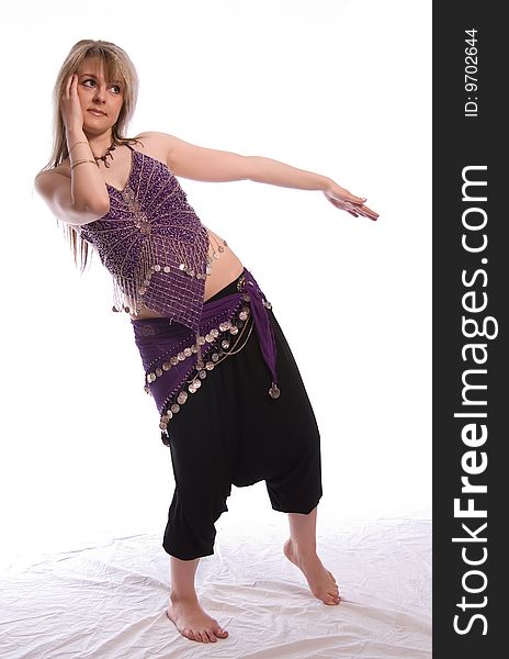 Indian dance. Young woman on white background.