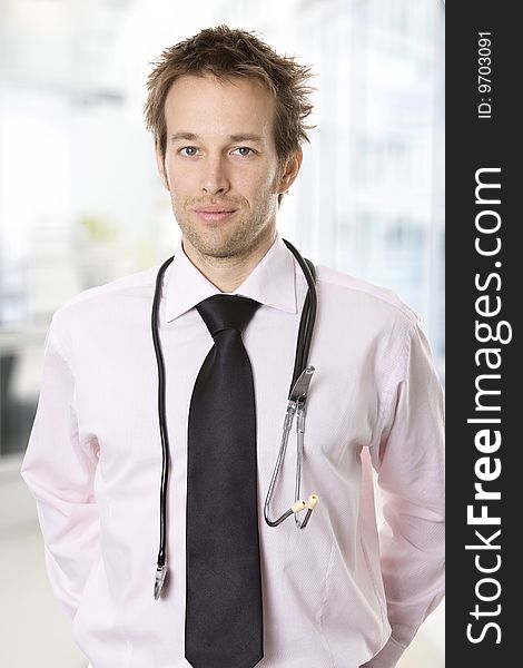 Closeup portrait of a young, confident doctor with stethoscope. Closeup portrait of a young, confident doctor with stethoscope