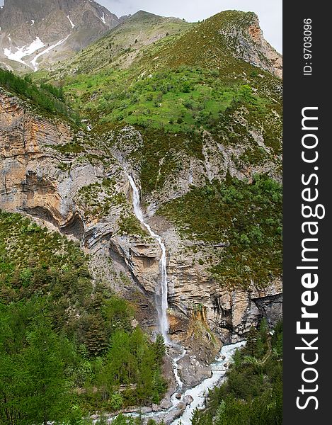 Waterfall In The Mountains