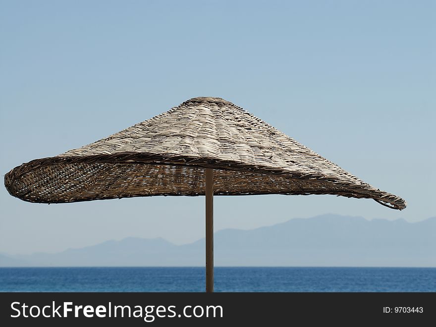 Old and grunge parasol at the beach