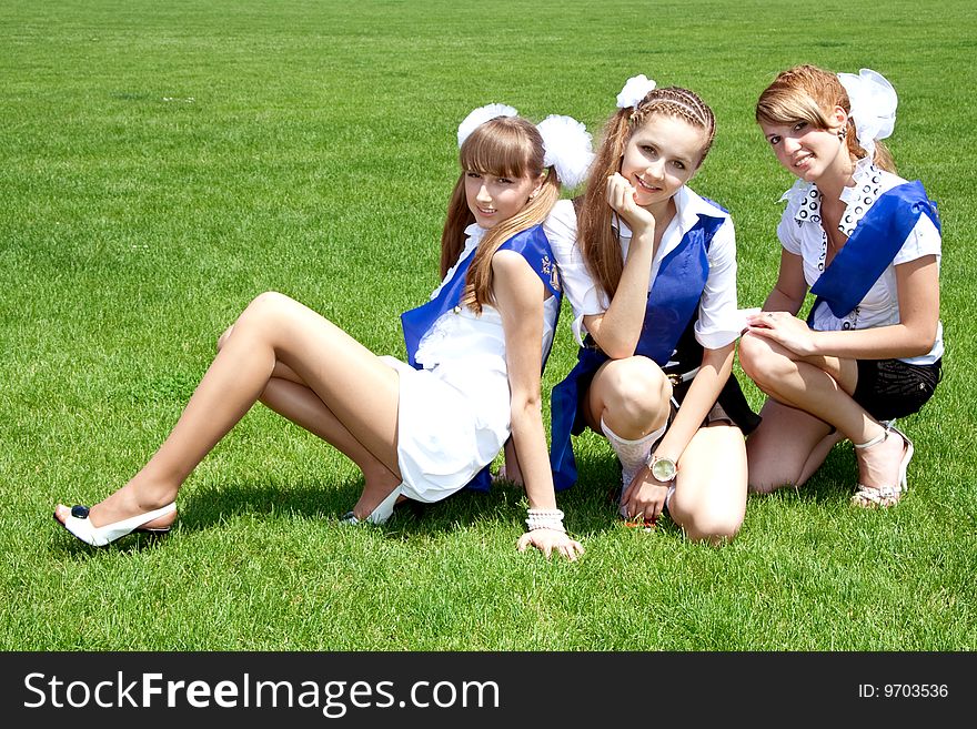 Three funny graduates posing outdoors