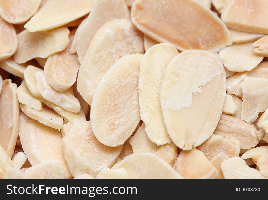 A macro shot of shaved almonds.