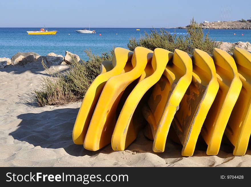 Yellow sunbeds on the beach