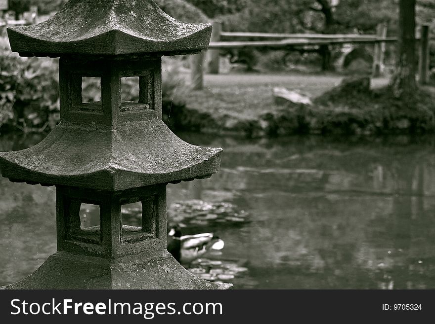 Vintage photo of stoned sculpture in a japanese garden