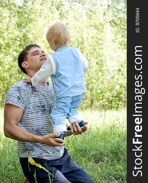 Father And Little Son Outdoor Fun In Summer