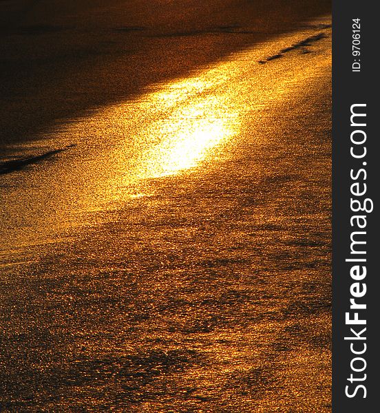 Wet road after sprinkling-machine with sun reflection. Wet road after sprinkling-machine with sun reflection