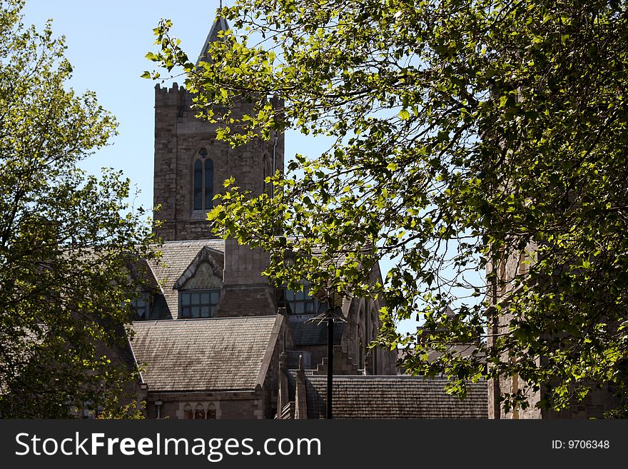 Scenic view of Christ Church cathedral with leafy trees in foreground, Dublin city, Ireland. Scenic view of Christ Church cathedral with leafy trees in foreground, Dublin city, Ireland.