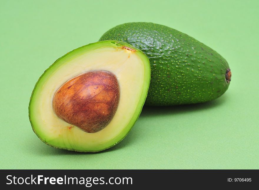 Avocado on green a background