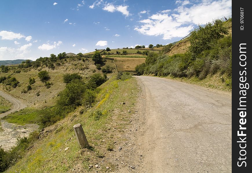 Sandy country path in Georgia Caucasus, Summer sunny day. Sandy country path in Georgia Caucasus, Summer sunny day.