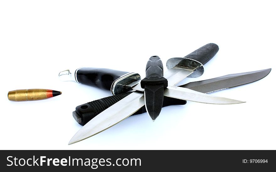 Four lethal knife`s crossed and bullet isolated on white background. Four lethal knife`s crossed and bullet isolated on white background