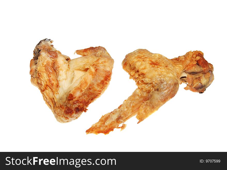 Two pieces of cooked chicken isolated on white. Two pieces of cooked chicken isolated on white