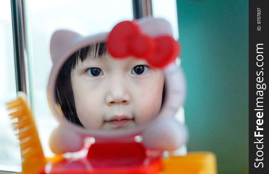 Bright picture of adorable chinese girl in the Mirror. Bright picture of adorable chinese girl in the Mirror
