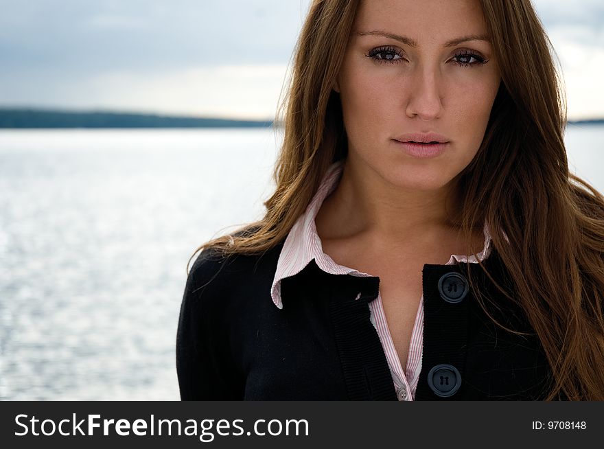 Young Beautiful Businesswoman In Front Of A Lake