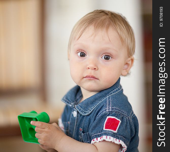 Portrait of a baby with a toy - shallow DOF