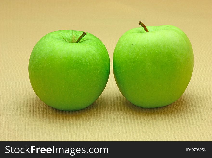 Two fresh green apples (background)